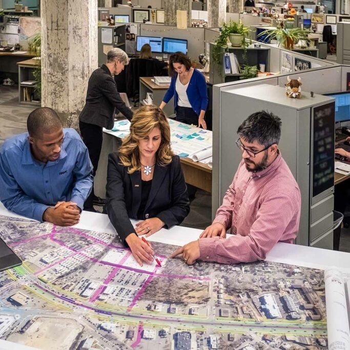 Baltimore-Office-People-Working RK&K Team Members Reviewing Design Plans in the Office in Baltimore, MD