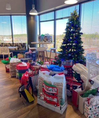 Angel Tree with Presents in Raleigh Office Break Room