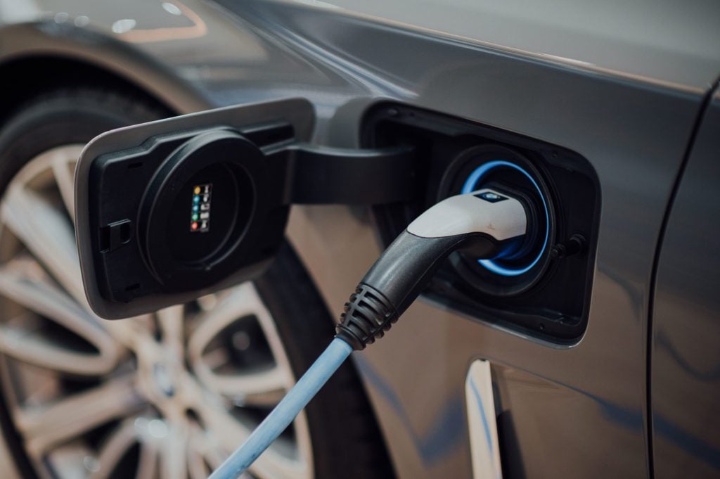 A typical EV charging port on an electric vehicle.