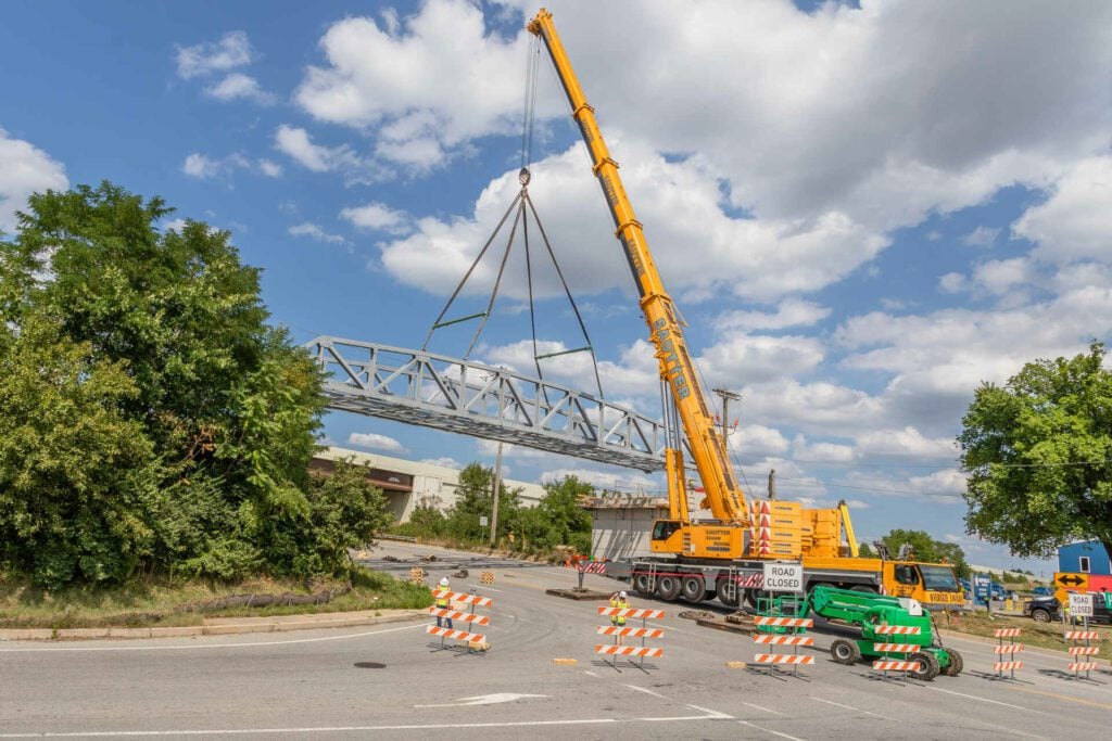 Chester Valley Trail pedestrian truss erection. Lifting the extension into place.