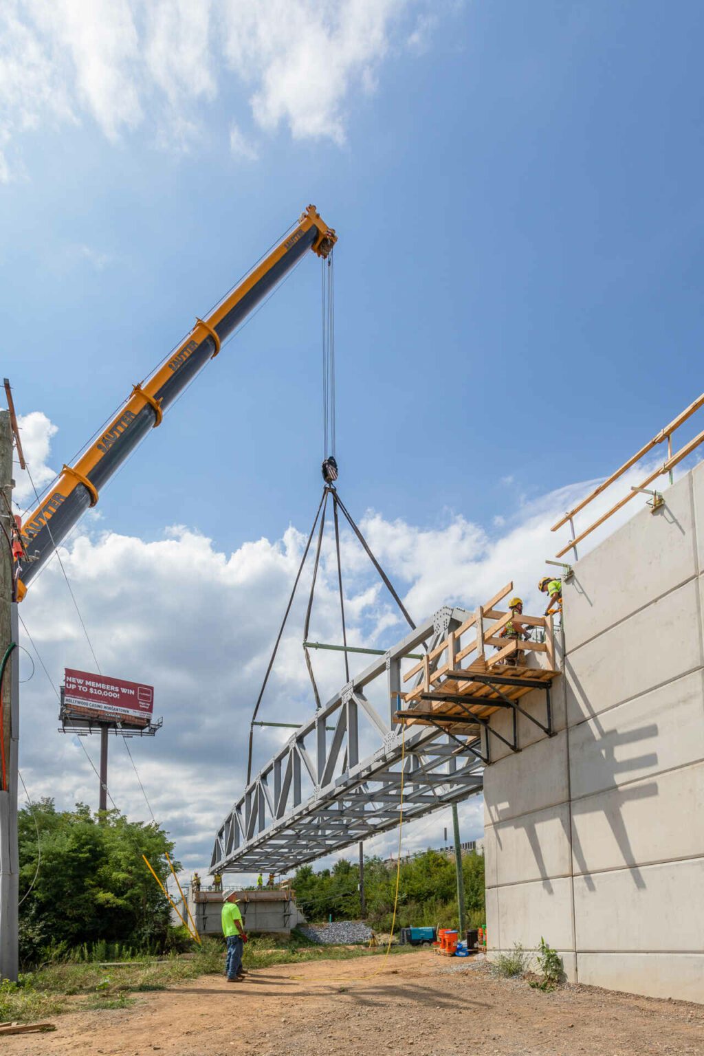 Chester Valley Trail pedestrian truss erection. Lifting the extension into place.