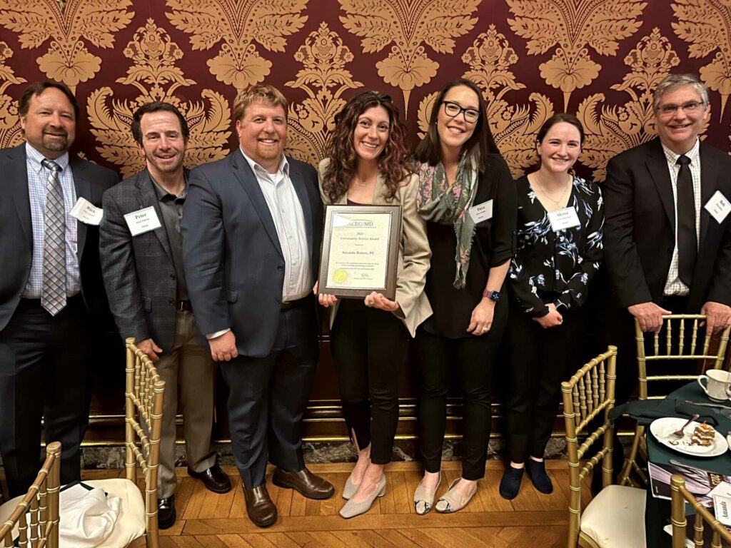 Senior Project Engineer Amanda Barrett, PE (center) received the 2023 Community Service Award from ASCE/MD.