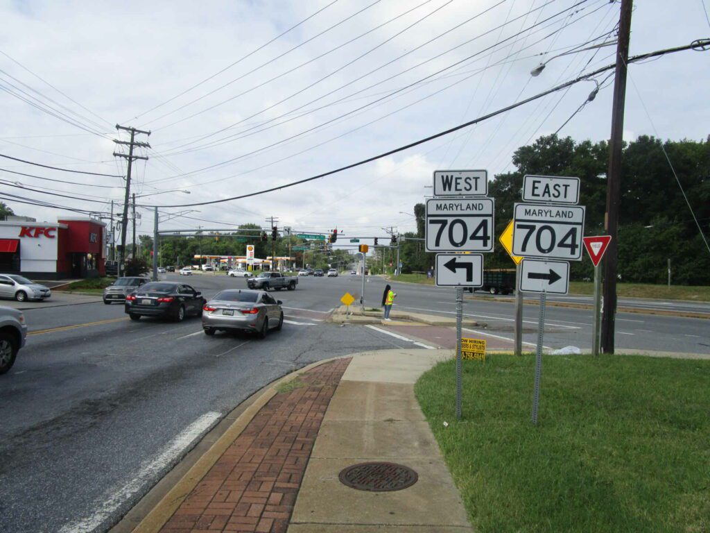 Kayla Cash examines a pedestrian crossing