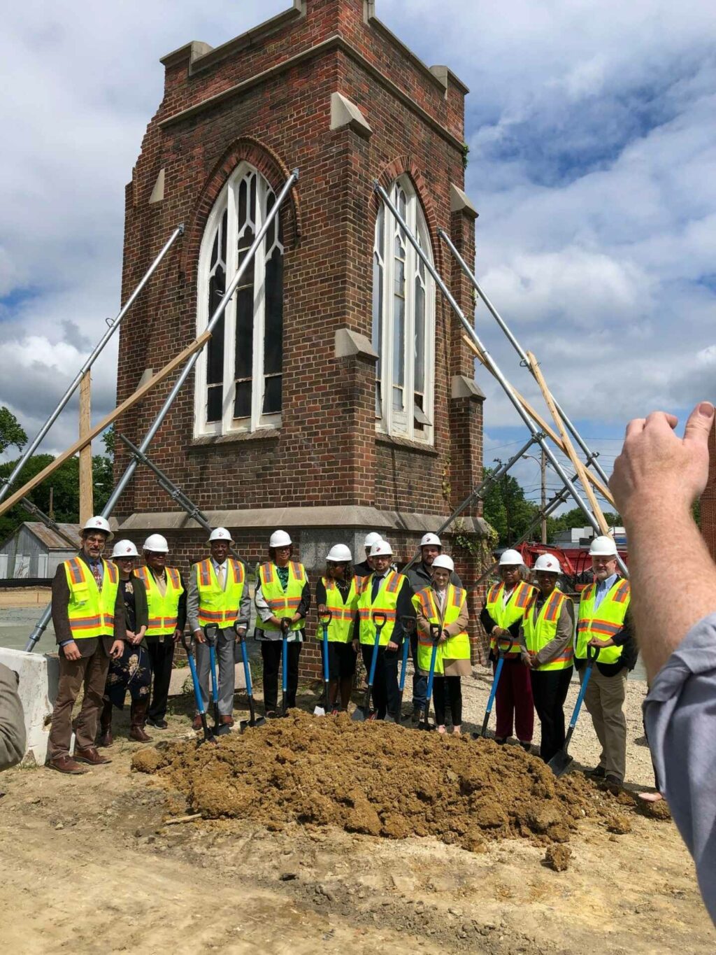 a crew celebrating groundbreaking for brookland apartments