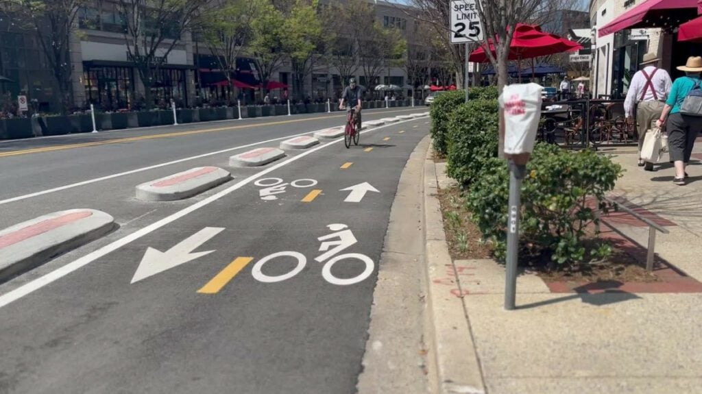 A man rides his bicycle to work.