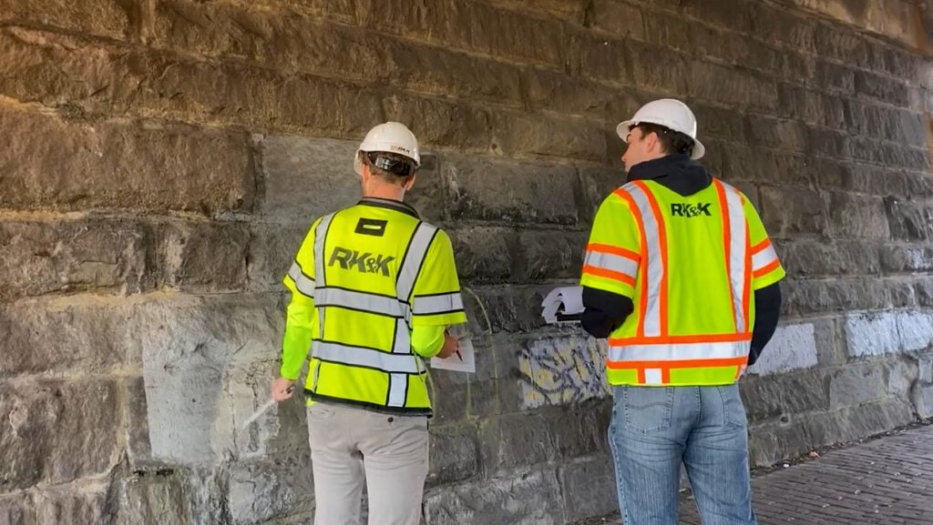 Two workers discussing project details